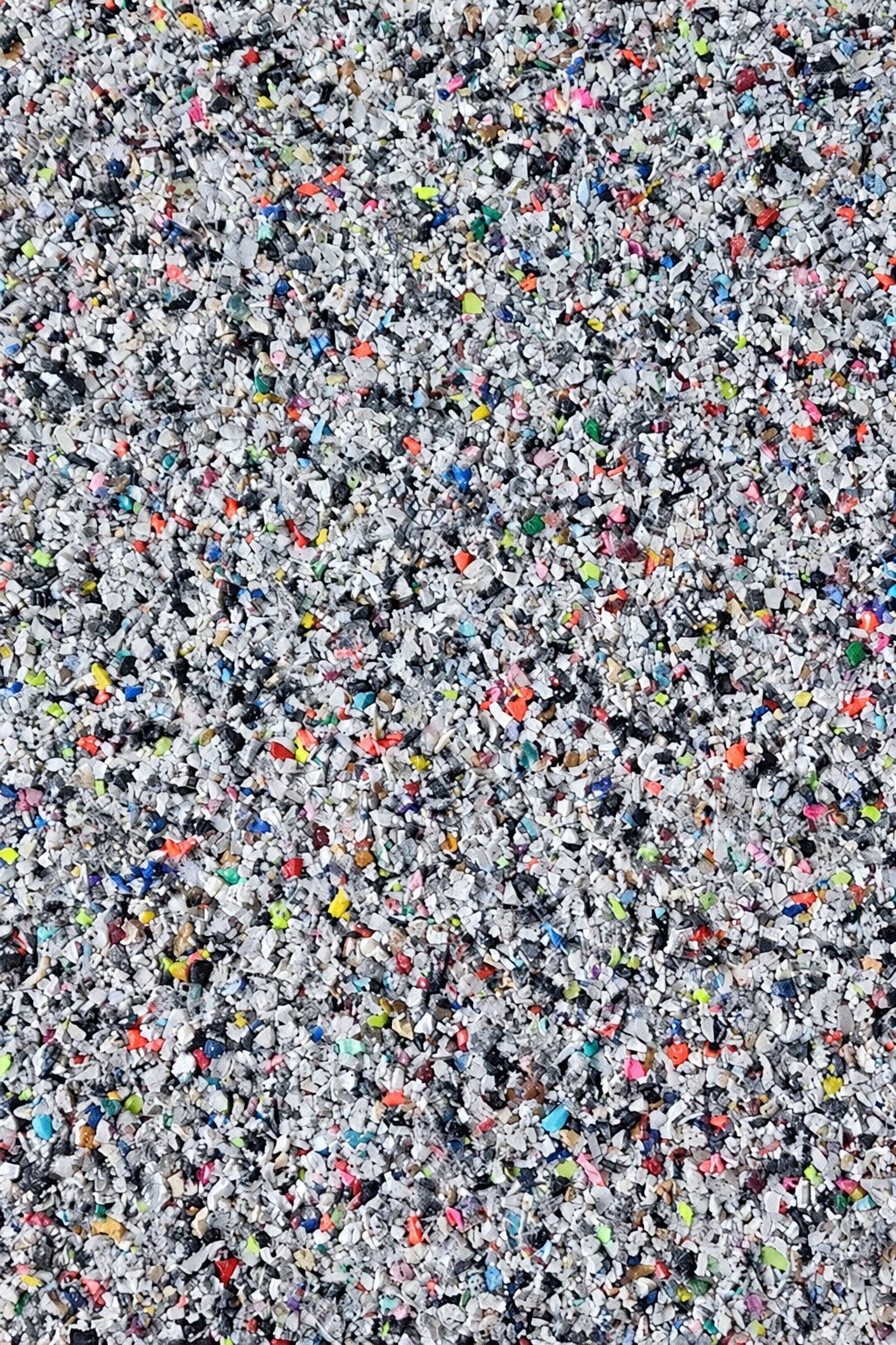 Recycled EVA and rubber granules mixed together.